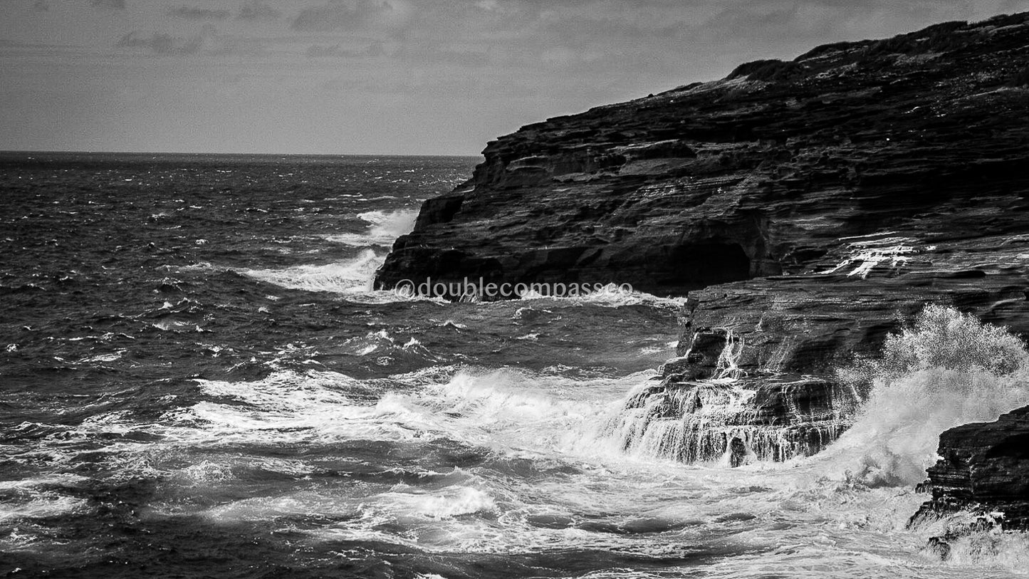 Black and white photo of the cost of Oahu